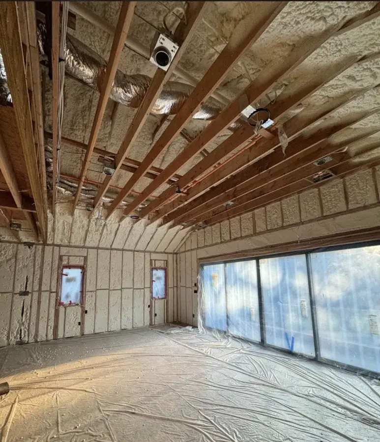 Interior walls and ceiling insulated with spray foam during new construction in Grayslake